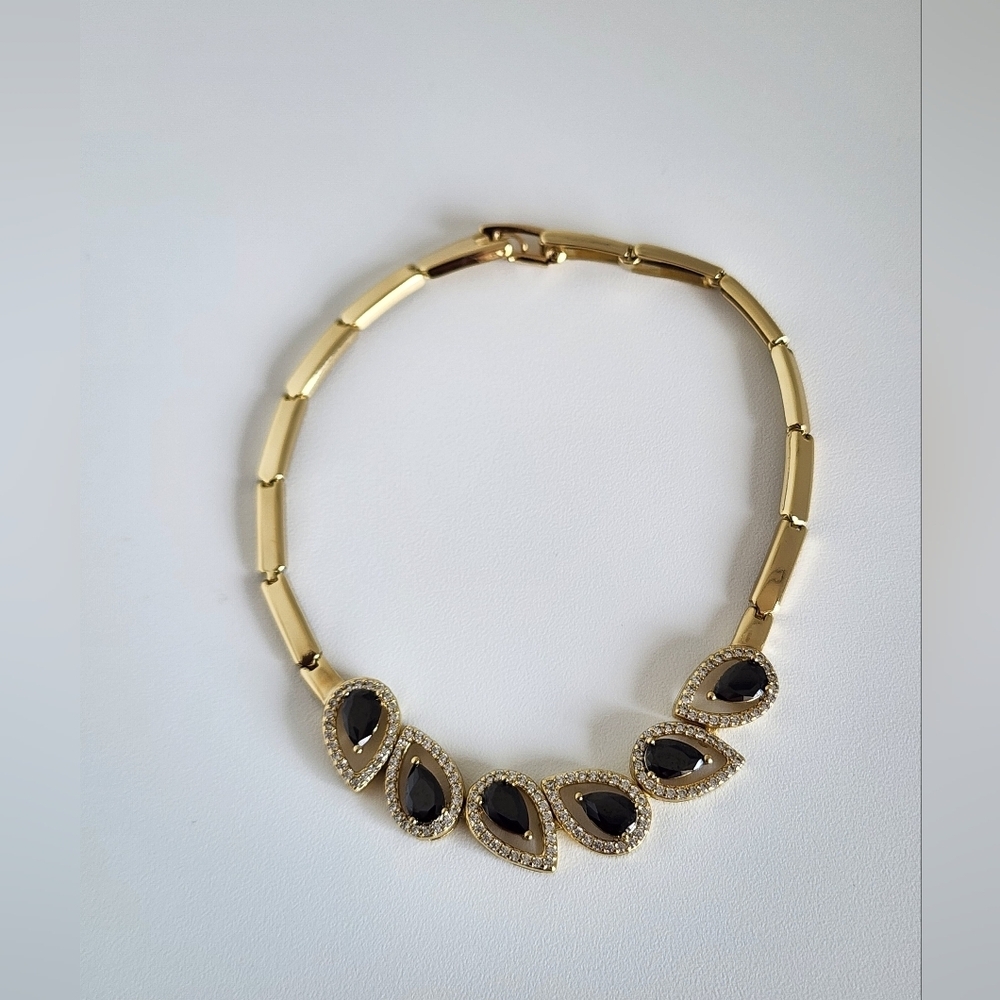 Elegant Gold Pkated and Black Bracelet